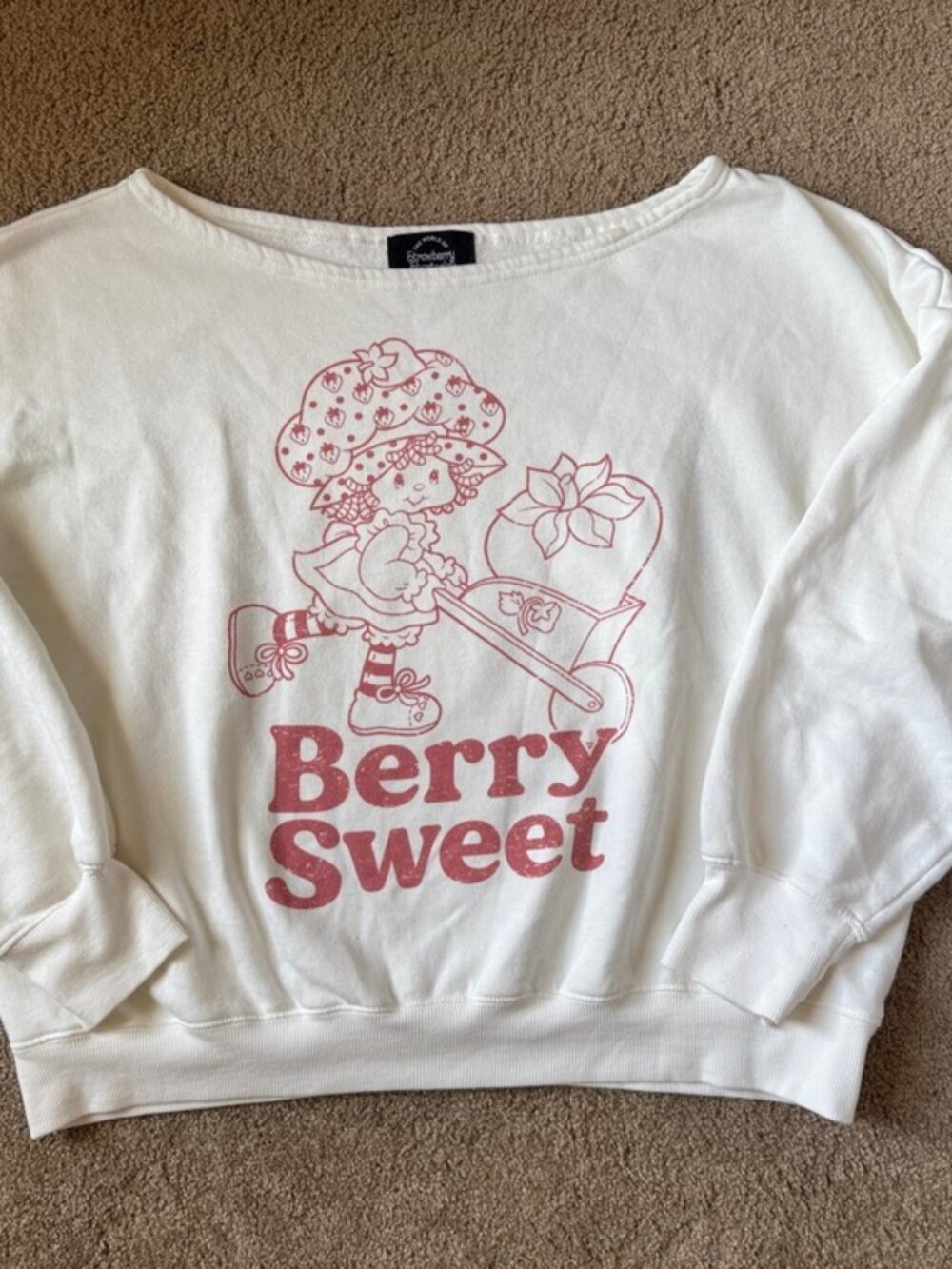 Strawberry Shortcake Off-the-shoulder sweatshirt screenprinted design, Junior’s